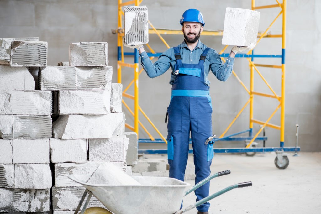 Builder with blocks indoors